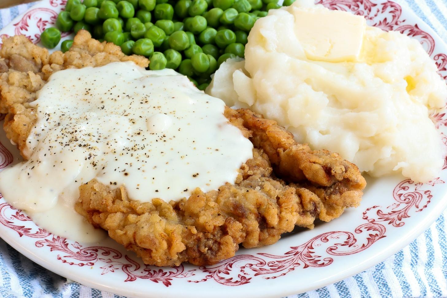  A sizzling hot plate of crispy and tender chicken-fried steak ready to be devoured!