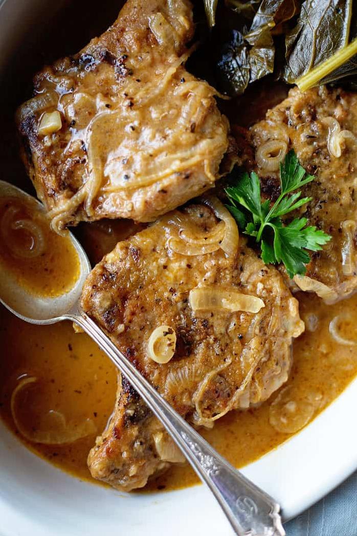 Get ready to dive into a plate of southern comfort with these smothered pork chops.