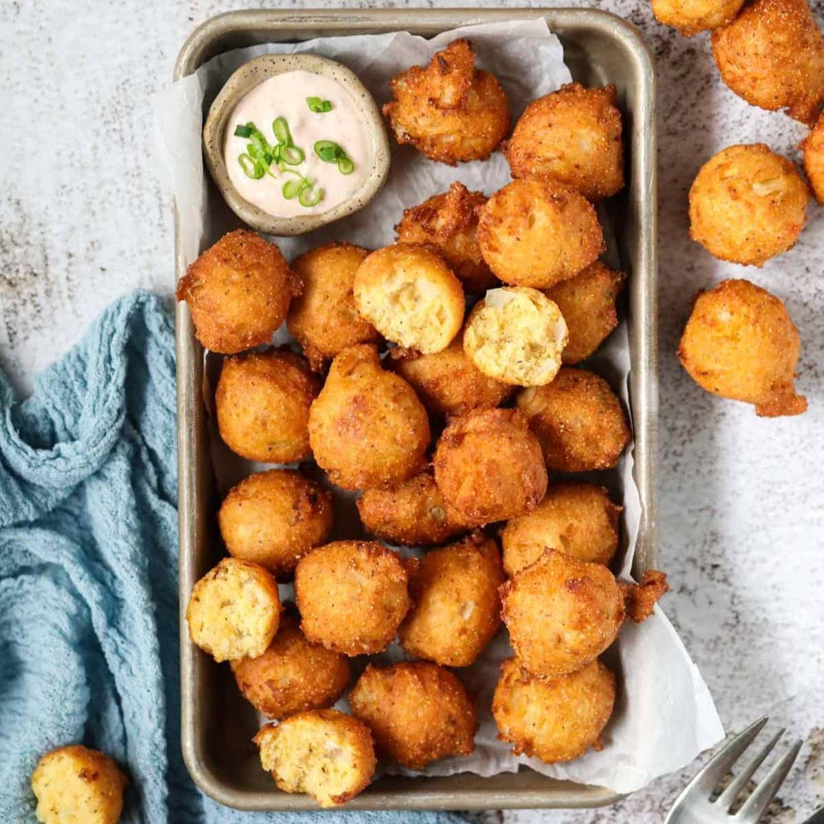  Served hot and fresh, these hush puppies are a match made in heaven for seafood lovers.