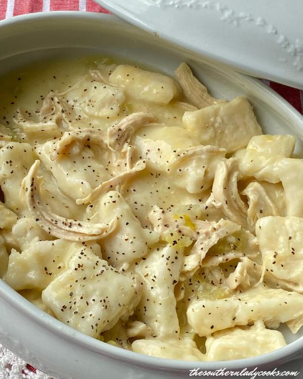  Tender chicken and fluffy dumplings - a comforting feast for the senses.