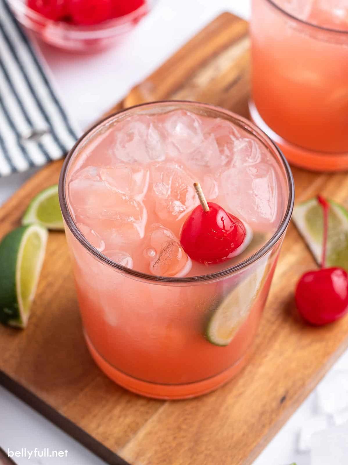  The vibrant colors of the cherry and lime make this a perfect summertime drink for any occasion.