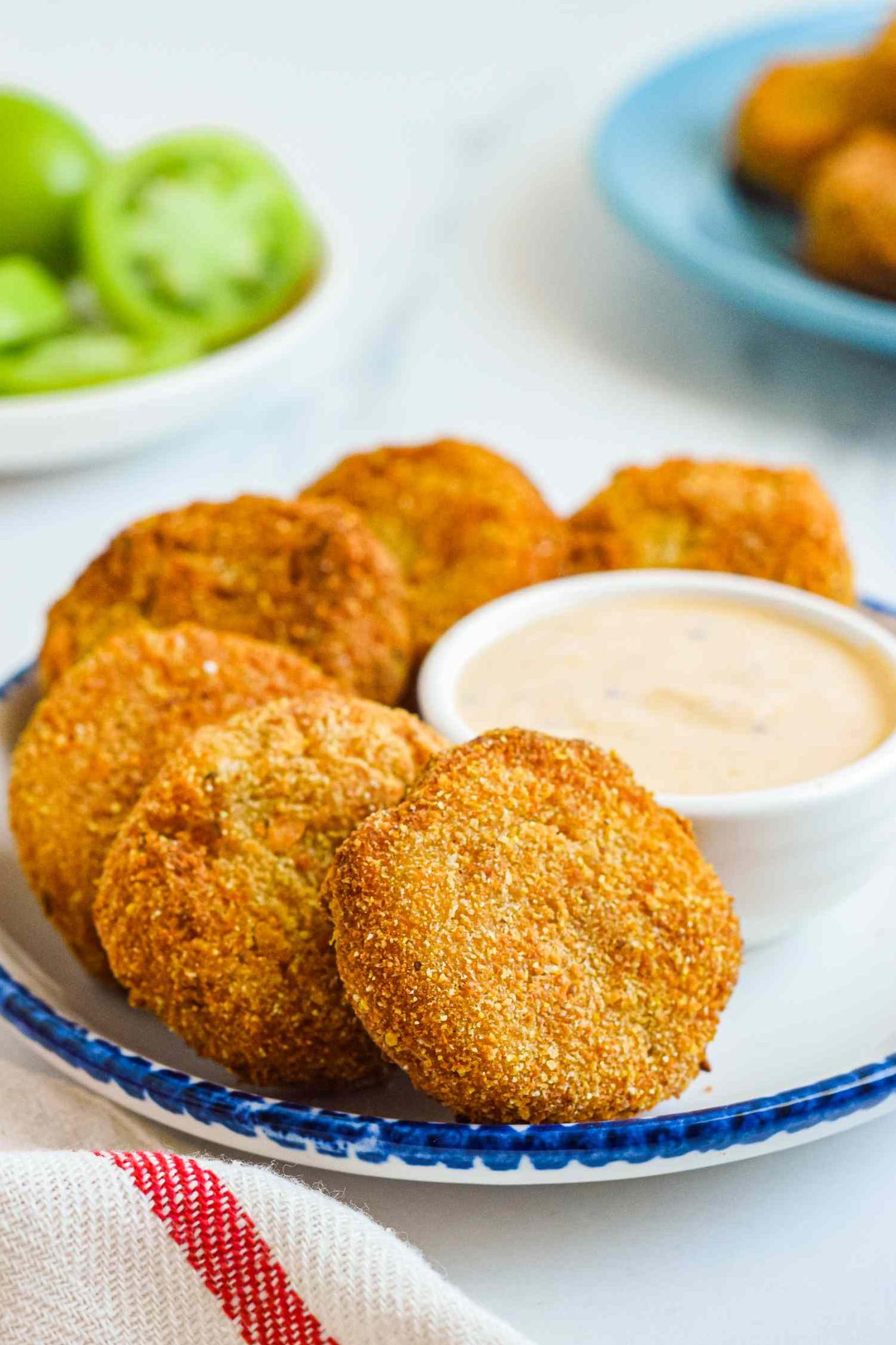  Thick slices of unripe green tomatoes dipped in a flavorful buttermilk and cornmeal batter.