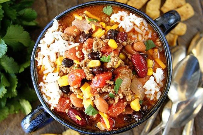  Veggies, beans, and meat blend together in a masterpiece taco soup.